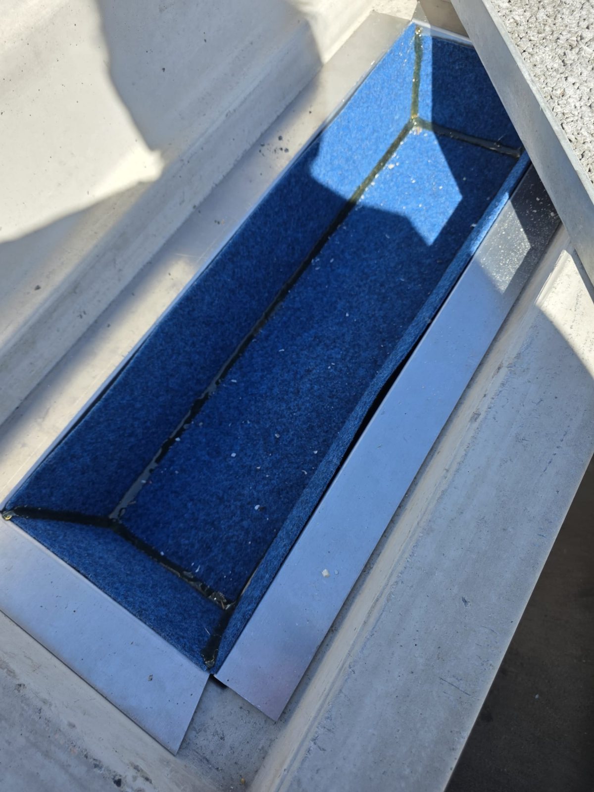 The ETI chamber with the tray removed, the blue ARI Water Filter lining the chamber in place