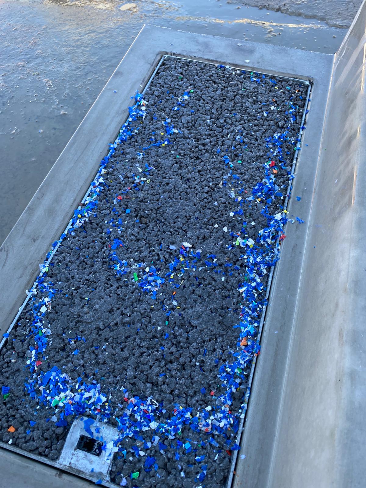 Shredded plastic debris sitting on the closed surface of the ETI tray after rain – nothing has entered the inlet