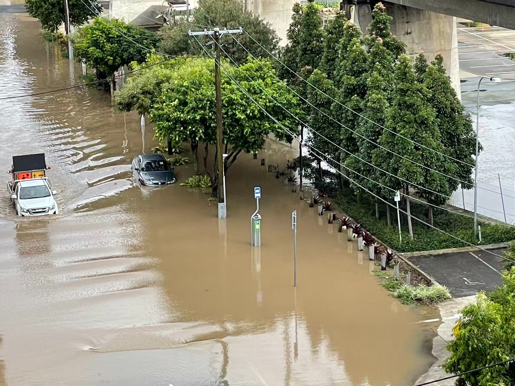 A city street under floodwater – sealed roads with nowhere for the rain to drain